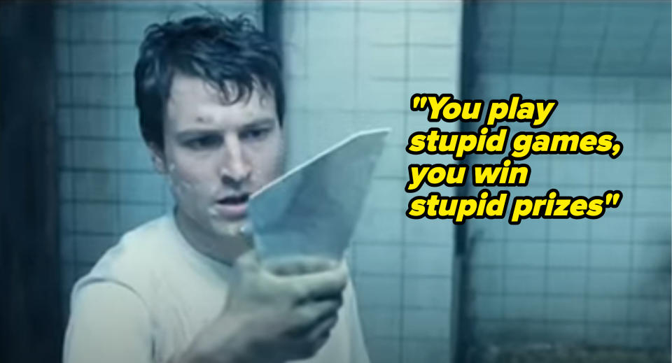 actor holding up mirror shard in saw with taylor lyrics 'you play stupid games you win stupid prizes'