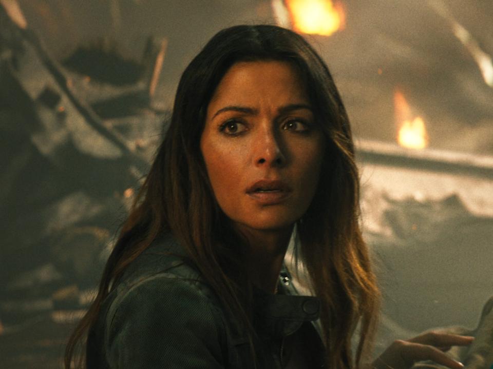 Sarah Shahi as Adrianna and Pierce Brosnan as Kent Nelson/Doctor Fate in "Black Adam."