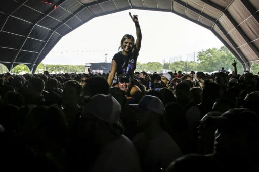 A woman reacts as Pusha T performs during eighth annual Governors Ball Music Festival in Randalls Island in New York on June 2, 2018