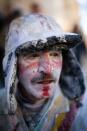 IBI, SPAIN - DECEMBER 28: A Reveller poses after taking part in the battle of 'Enfarinats', a flour fight in celebration of the Els Enfarinats festival on December 28, 2012 in Ibi, Spain. Citizens of Ibi annually celebrate the festival with a battle using flour, eggs and firecrackers. The battle takes place between two groups, a group of married men called 'Els Enfarinats' which take the control of the village for one day pronouncing a whole of ridiculous laws and fining the citizens that infringe them and a group called 'La Oposicio' which try to restore order. At the end of the day the money collected from the fines is donated to charitable causes in the village. The festival has been celebrated since 1981 after the town of Ibi recovered the tradition but the origins remain unknown. (Photo by David Ramos/Getty Images)