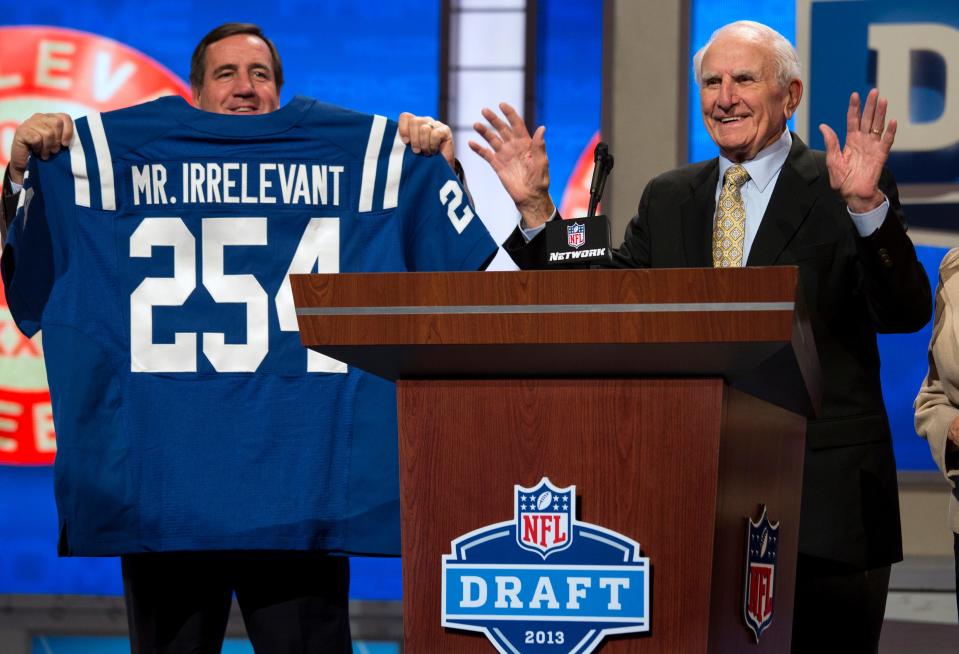 Former NFL football receiver Paul Salata, right, announces the 254th overall pick of the NFL Draft at Radio City Music Hall in New York on April 27, 2013. Salata, who created the Mr. Irrelevant Award that honors the last selection of the NFL draft, after playing football at Southern California and in the NFL and Canadian Football League, died on Oct. 16, 2021. He was 94.