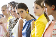 Models line up backstage at the alice + olivia by Stacey Bendet Spring 2013 show during Fashion Week in New York on Monday, Sept. 10, 2012. (Photo by Charles Sykes/Invision/AP)