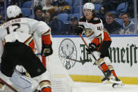 Anaheim Ducks center Trevor Zegras (46) passes the puck from behind the net during the second period of an NHL hockey game against the Buffalo Sabres, Tuesday, Dec. 7, 2021, in Buffalo, N.Y. (AP Photo/Jeffrey T. Barnes)