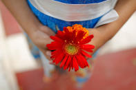 <p>A Bangladeshi child holds flowers as she waits to pay tribute at Martyr’s Monument, or Shaheed Minar, on International Mother Language Day in Dhaka, Bangladesh, Tuesday, Feb. 21, 2017. International Mother Language Day is observed in commemoration of the movement where a number of students died in 1952, defending the recognition of Bangla as a state language of the former East Pakistan, now Bangladesh. (AP Photo/A.M. Ahad) </p>