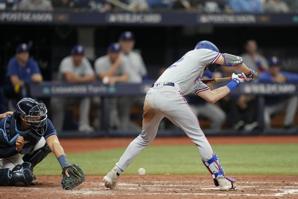 Texas Rangers' Evan Carter is hit by a pitch from Tampa Bay Rays relief pitcher Zack Littell in the eighth inning during Game 2 in an AL wild-card baseball playoff series, Wednesday, Oct. 4, 2023, in St. Petersburg, Fla. (AP Photo/John Raoux)