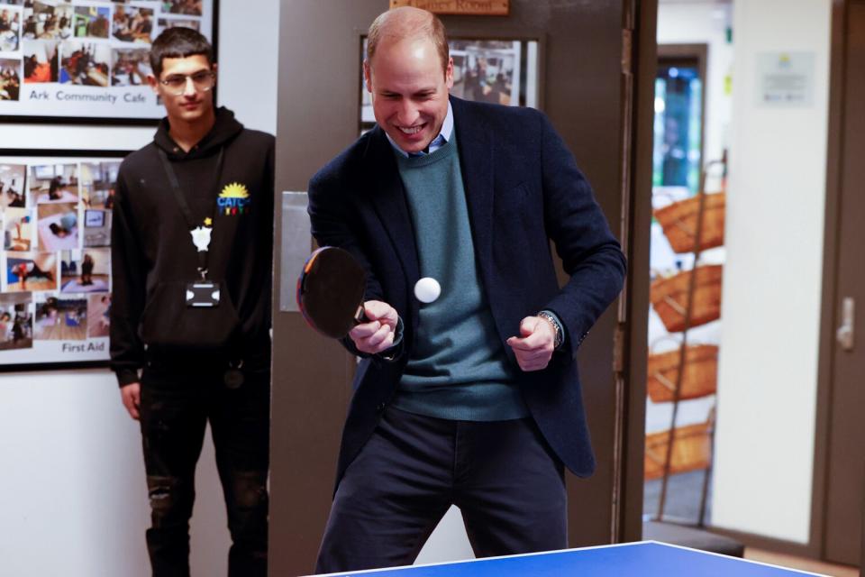 Prince William, Duke of Cambridge plays table tennis during his visit to CATCH