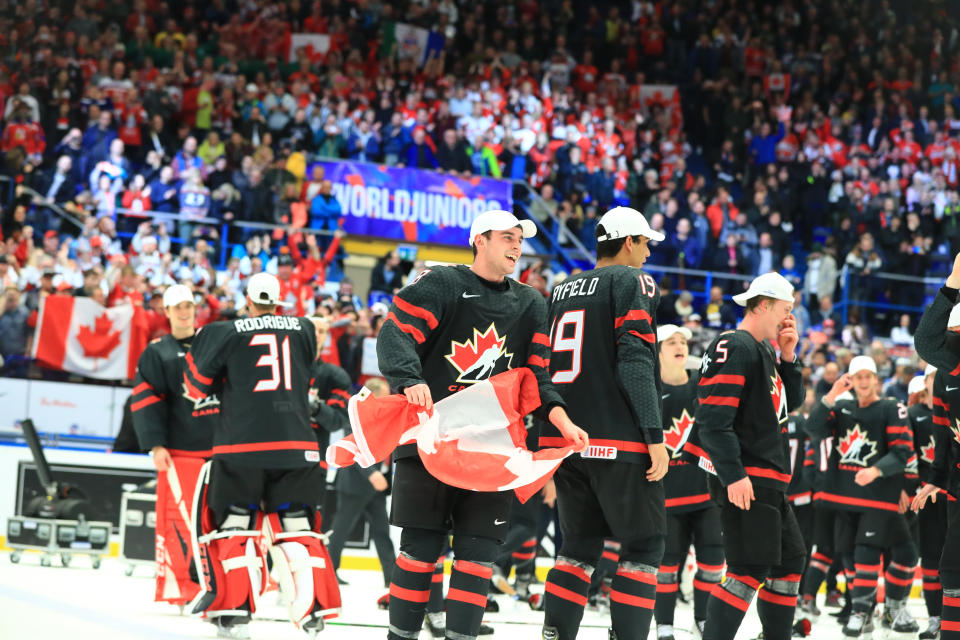 OSTRAVA, CZECH REPUBLIC - JANUARY 5, 2020: Canadian players Liam Foudy, Quinton Byfield, and Jacob Bernard-Docker (L-R front) celebrate with the trophy after the medal ceremony for the 2020 World Junior Ice Hockey Championship final match between Canada and Russia at Ostravar Arena; Canada won 4-3. Peter Kovalev/TASS (Photo by Peter Kovalev\TASS via Getty Images)