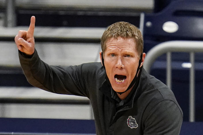 FILE - Gonzaga head coach Mark Few calls a play for his team as they play against Oklahoma in the first half of a second-round game in the NCAA men's college basketball tournament at Hinkle Fieldhouse in Indianapolis, in this Monday, March 22, 2021, file photo. Gonzaga carried a No. 1 ranking all last season before falling a win short of becoming college basketball’s first unbeaten national champion in 45 years. Mark Few’s Bulldogs start this season in the same position, hoping to complete that final step this time around. The Zags were the runaway top choice in The Associated Press Top 25 men’s college basketball preseason poll released Monday, Oct. 18, 2021. (AP Photo/Michael Conroy, File)