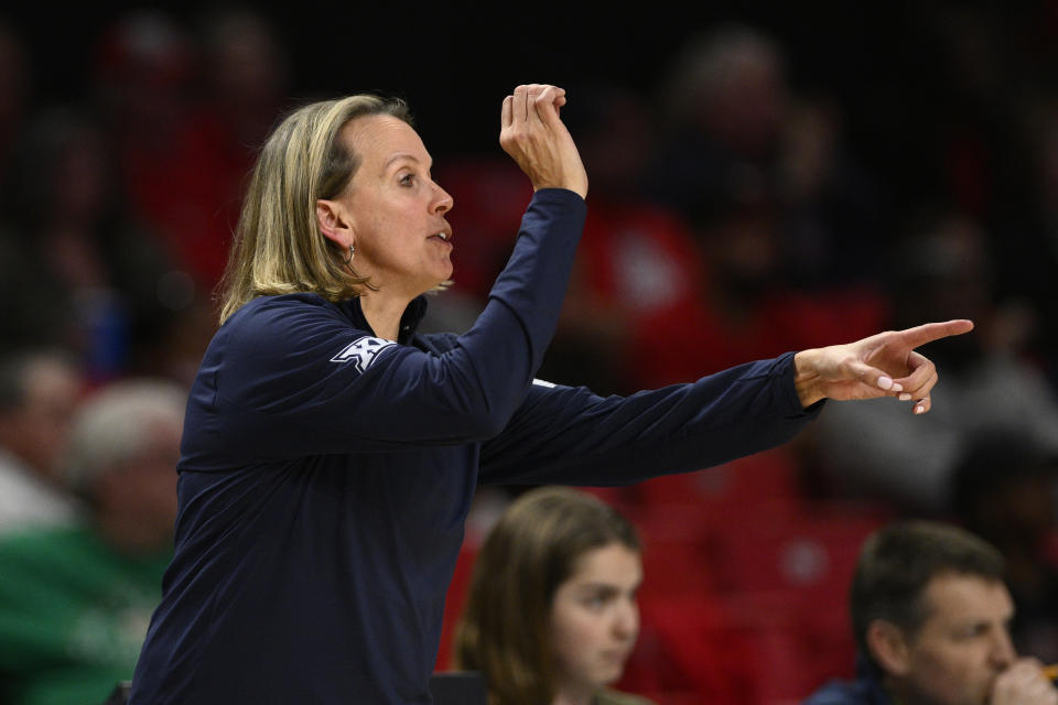 West Virginia head coach Dawn Plitzuweit gestures in the second half of a first-round college basketball game in the NCAA Tournament against Arizona, Friday, March 17, 2023, in College Park, Md. Arizona won 75-62. (AP Photo/Nick Wass)