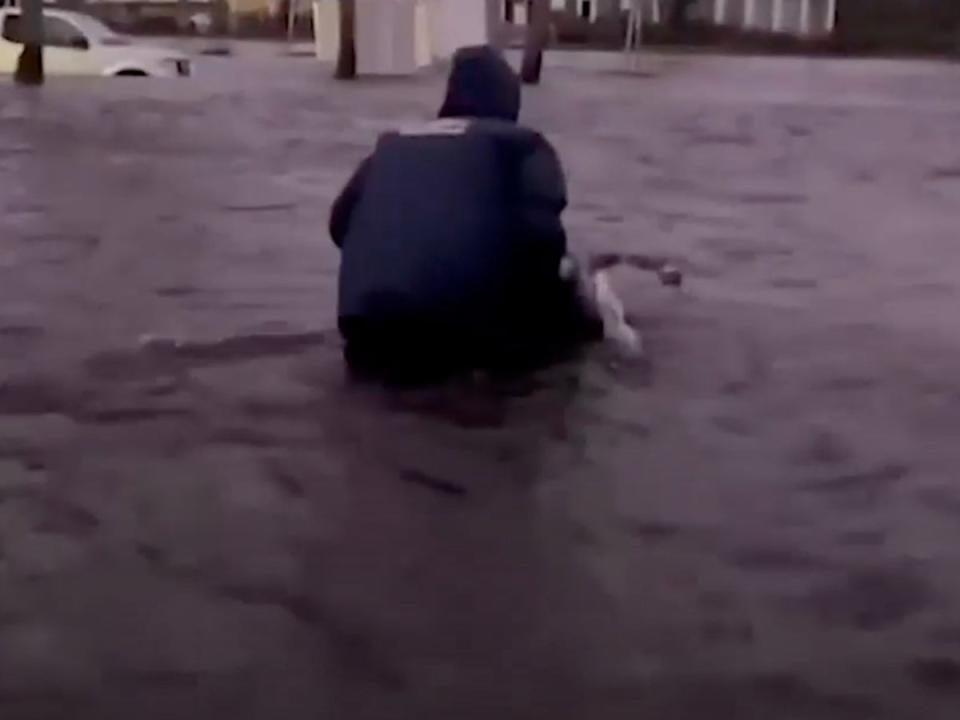 Johnny Lauder wheels his disabled mother through flood waters after Hurricane Ian struck Naples, Florida (Johnny Lauder / Weather Channel)