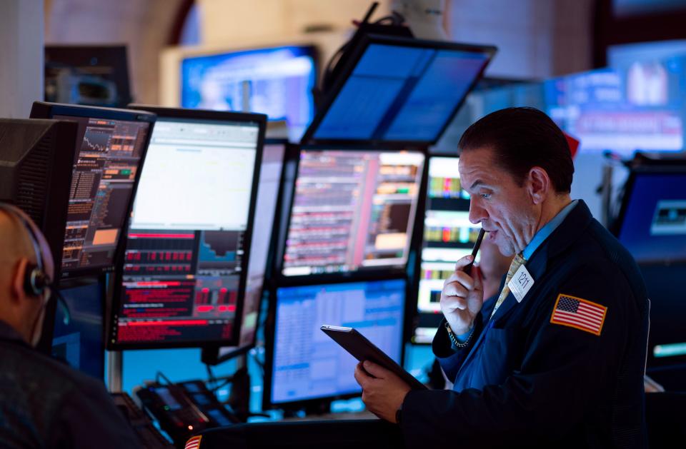 Traders work before the closing bell at the New York Stock Exchange (NYSE) on August 14, 2019 in New York City. - It was an ugly day for Wall Street, as stocks plummeted Wednesday amid worsening economic fears after US Treasury yields briefly inverted, flashing a warning sign for a coming recession. But US President Donald Trump once again blamed the Fed for the economic woes and the yield curve inversion, saying the US central bank is a bigger threat than China and is "clueless." The Dow Jones Industrial Average fell 3.1 percent to finish at 25,479.42, a loss of about 800 points -- its worst day of 2019. (Photo by Johannes EISELE / AFP)        (Photo credit should read JOHANNES EISELE/AFP/Getty Images)