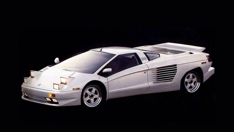 A photo of a white Cizeta-Moroder supercar taken in a studio. 