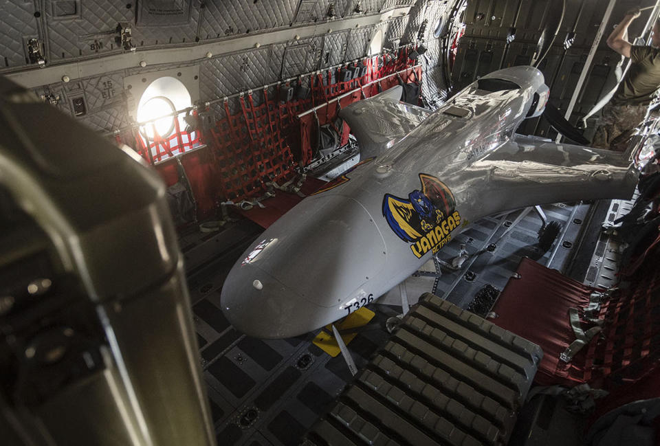 A Turkish-made Bayraktar TB2 is a medium-altitude long-endurance (MALE) unmanned combat aerial vehicle (UCAV), drone capable of remotely controlled or autonomous flight operations, is seen at the Siauliai military air force base some 230 km (144 miles) east of the capital Vilnius, Lithuania, Friday, July 1, 2022. The Turkish company "Baykar", which produces unmanned military aircraft, decided to donate the combat drone "Bayraktar TB2" to Lithuania. (Lithuanian Ministry of National Defense via AP)