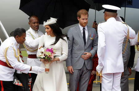 Britain's Prince Harry and Meghan, Duchess of Sussex on their arrival in Suva, Fiji, Tuesday, Oct. 23, 2018. Prince Harry and his wife Meghan are on day eight of their 16-day tour of Australia and the South Pacific.(AP Photo/Kirsty Wigglesworth,Pool) /Pool via REUTERS