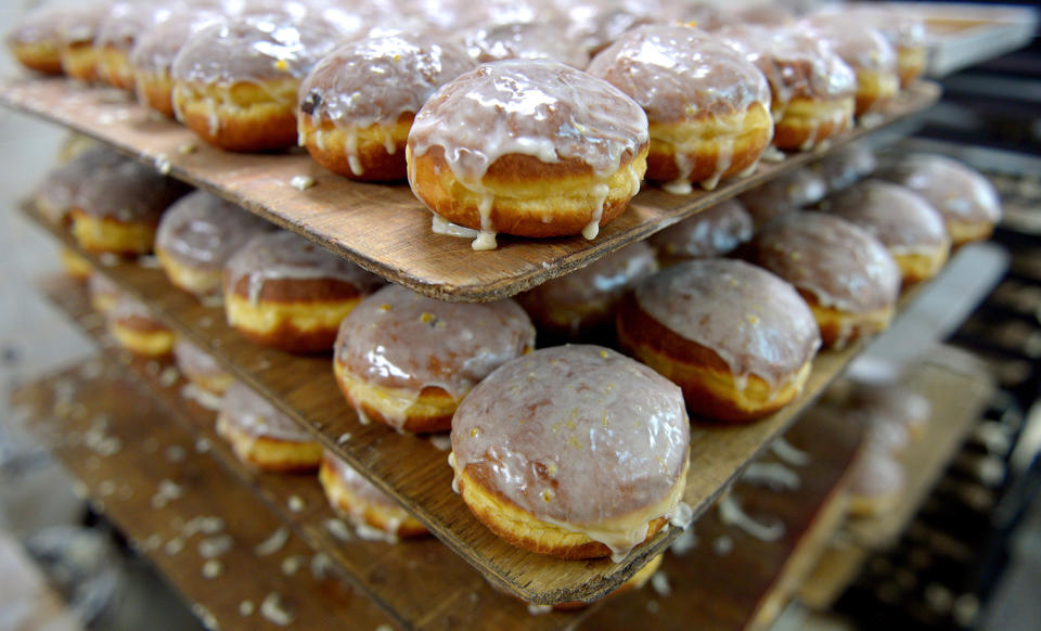 <p>View of donuts prepared for sale in a confectionery Rak & Orlowski in Rzeszow, Poland, Feb. 22, 2017. Fat Thursday (Tlusty Czwartek), this year celebrated on Feb. 23, is a traditional Polish feast marking the last Thursday before Lent. On this day people consume large quantities of donuts and ‘Angel Wings’ (faworki), french dough fingers with lots of powdered sugar. (Photo: Darek Delmanowicz/EPA) </p>