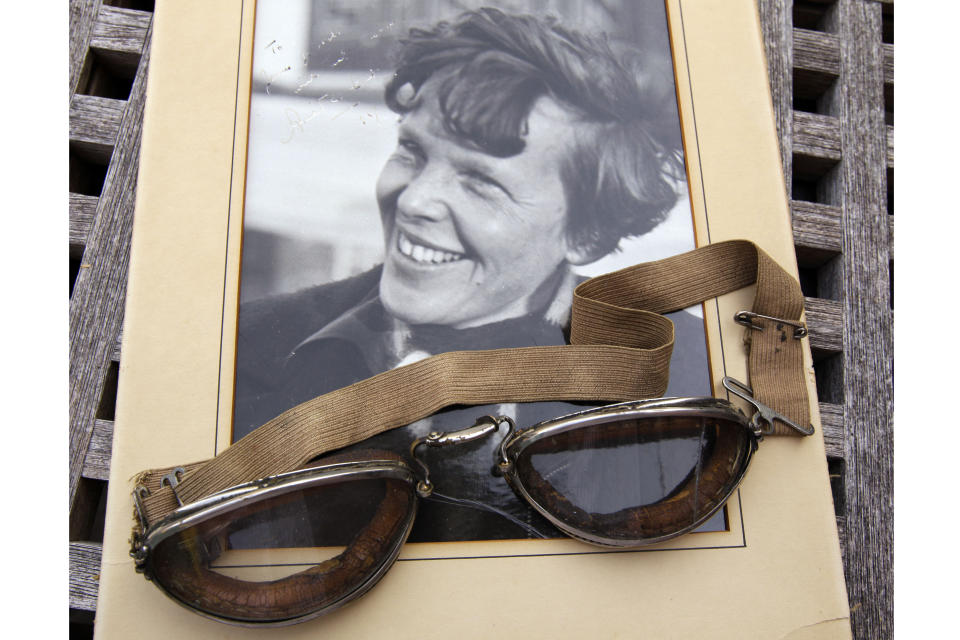 FILE - An original, unpublished personal photo of Amelia Earhart dated 1937, along with goggles she was wearing during her first plane crash are seen Friday, Sept. 9, 2011, at Clars Auction Gallery in Oakland, Calif. (AP Photo/Ben Margot, File)