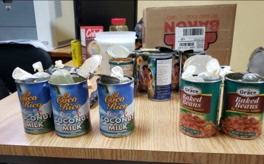 Two men attempted to smuggle $341,875 worth of cocaine in baked beans and coconut milk cans into London. They both just got prison sentences.