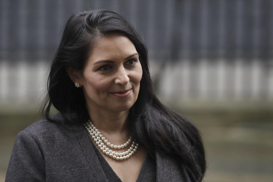British Lawmaker Priti Patel, the Home Secretary leaves 10 Downing Street in London, Thursday, Feb. 13, 2020. British Prime Minister Boris Johnson shook up his government on Thursday, firing and appointing ministers to key Cabinet posts. Johnson was aiming to tighten his grip on government after winning a big parliamentary majority in December's election. That victory allowed Johnson to take Britain out of the European Union in January. (AP Photo/Matt Dunham)