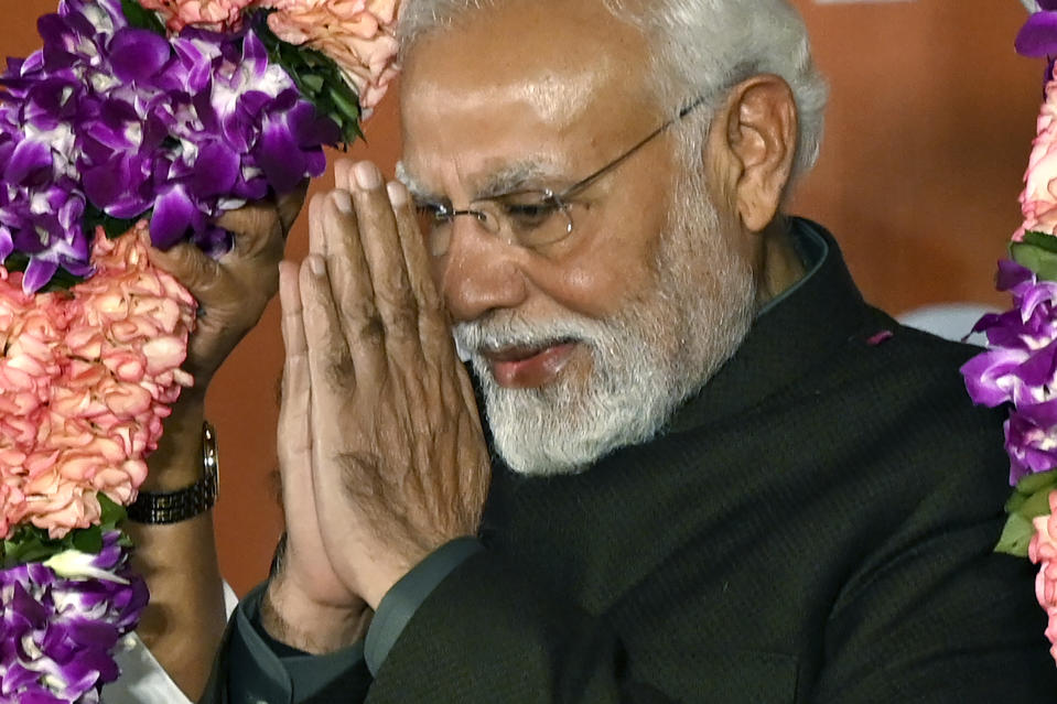 Indian Prime Minister Narendra Modi greets party worker during celebrations following Bharatiya Janata Party's victory in the state elections at the BJP headquarters in New Delhi, India, Sunday, Dec. 3, 2023. India's Hindu nationalist party was headed for a clear win in three out of four states Sunday, according to the election commission's website. (AP Photo)