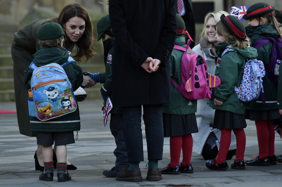 Britain's Kate Duchess of Cambridge speaks with pupils as she meets the members of the public at Centenary Square in Bradford northern England, Wednesday, Jan. 15, 2020. (AP Photo/Rui Vieira)
