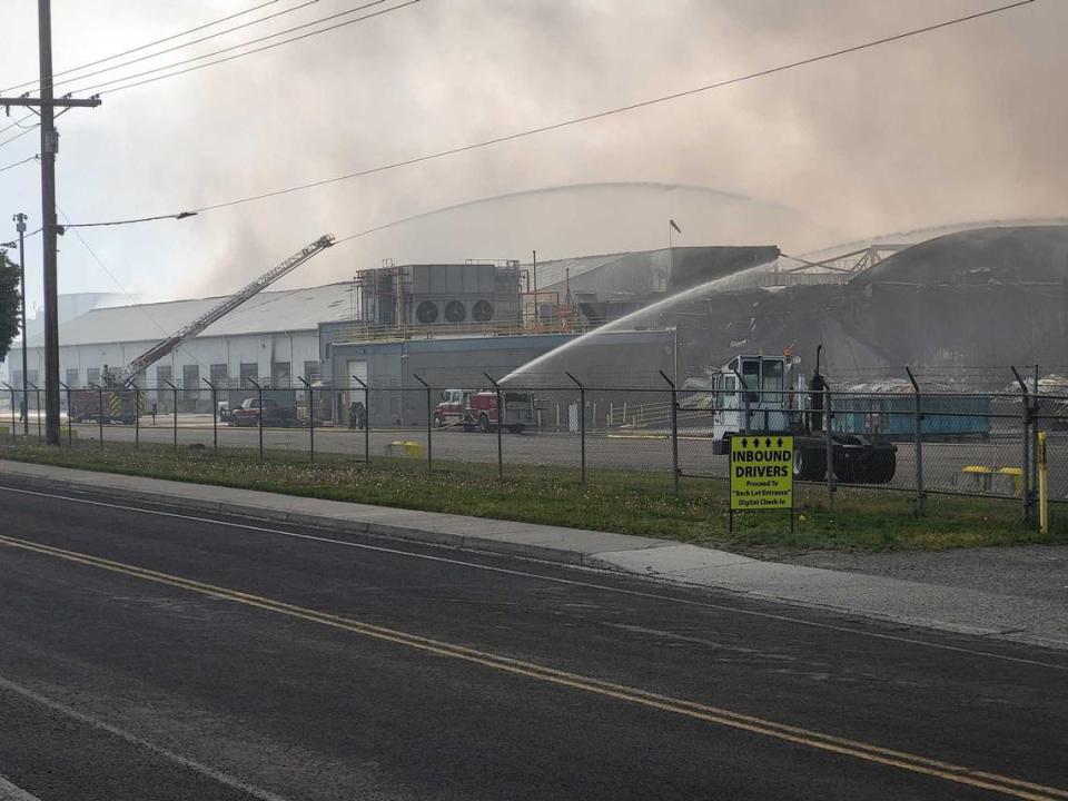 Wreckage from a collapsed warehouse in Finley continued to smolder a day later.