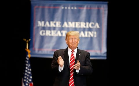 President Donald Trump arrives at a rally at the Phoenix Convention Center, Tuesday, Aug. 22, 2017, in Phoenix - Credit: AP