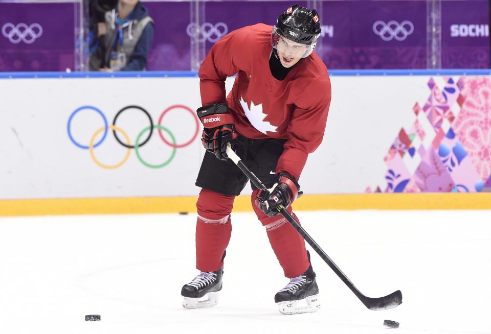 Team Canada captain Sidney Crosby shoots the puck as he and his teammates take part in a practice session during the 2014 Sochi Winter Olympics in Sochi, Russia, on Monday, Feb. 10, 2014. (AP Photo/The Canadian Press, Nathan Denette)