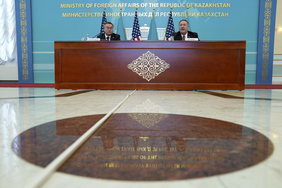 U.S. Secretary of State Mike Pompeo, right, holds a joint news conference with Kazakh Foreign Minister Mukhtar Tleuberdi at the Ministry of Foreign Affairs in Nur-Sultan, Kazakhstan, Sunday, Feb. 2, 2020. (Kevin Lamarque/Pool Photo via AP)