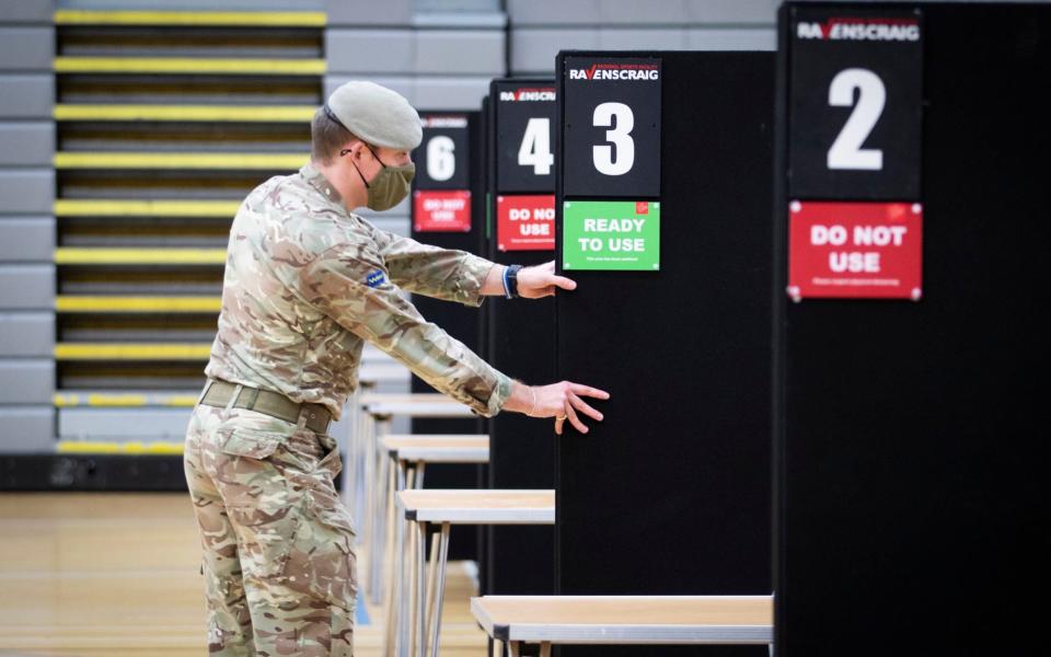 Members of the Royal Scots Dragoon Guard carry out a reconnaissance before setting up a Covidâ€“19 vaccination centre at the Ravenscraig Regional Sports Facility in Motherwell, Lanarkhire - PA