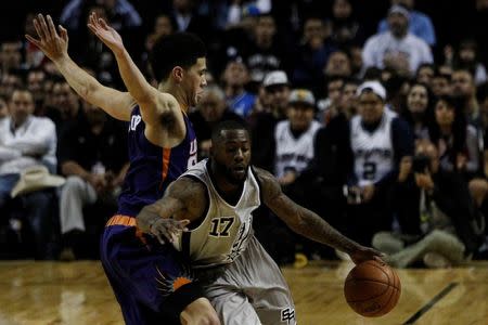 Basketball - San Antonio Spurs v Phoenix Suns - NBA Global Games - Arena Mexico, Mexico City, Mexico - 14/1/17. Devin Booker (1) of Phoenix Suns and Jonathon Simmons (17) of San Antonio Spurs in action. REUTERS/Carlos Jasso