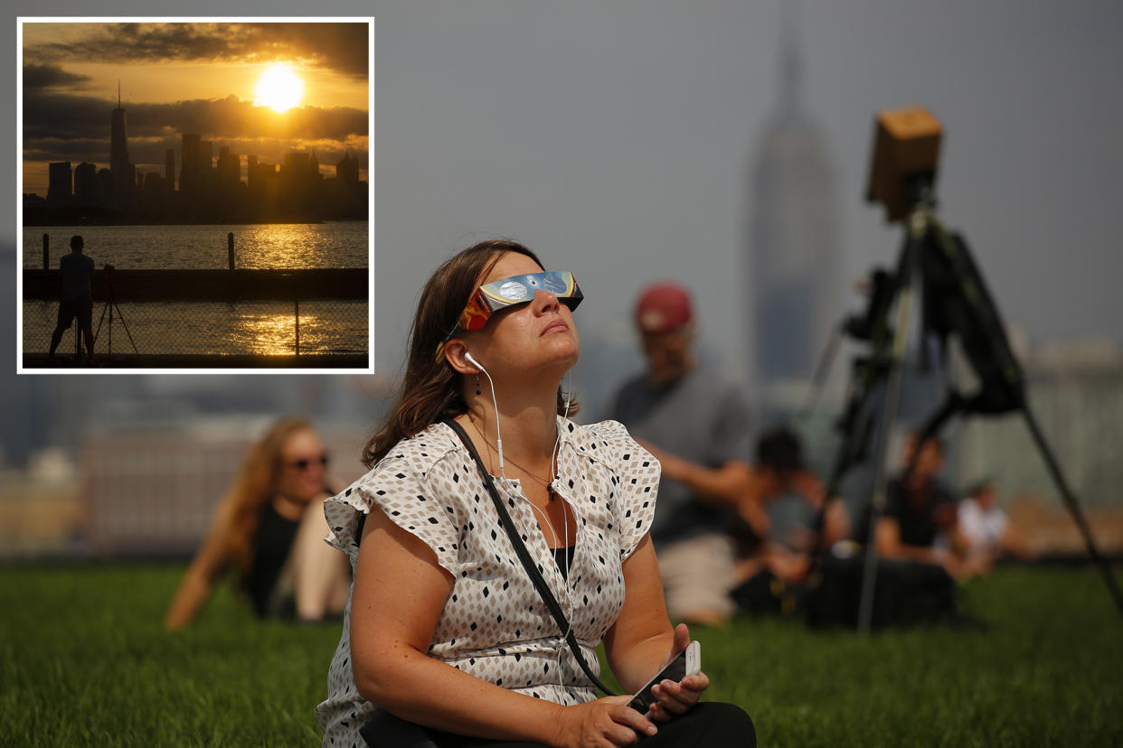 A girl watching the eclipse, main. Inset: skyline.