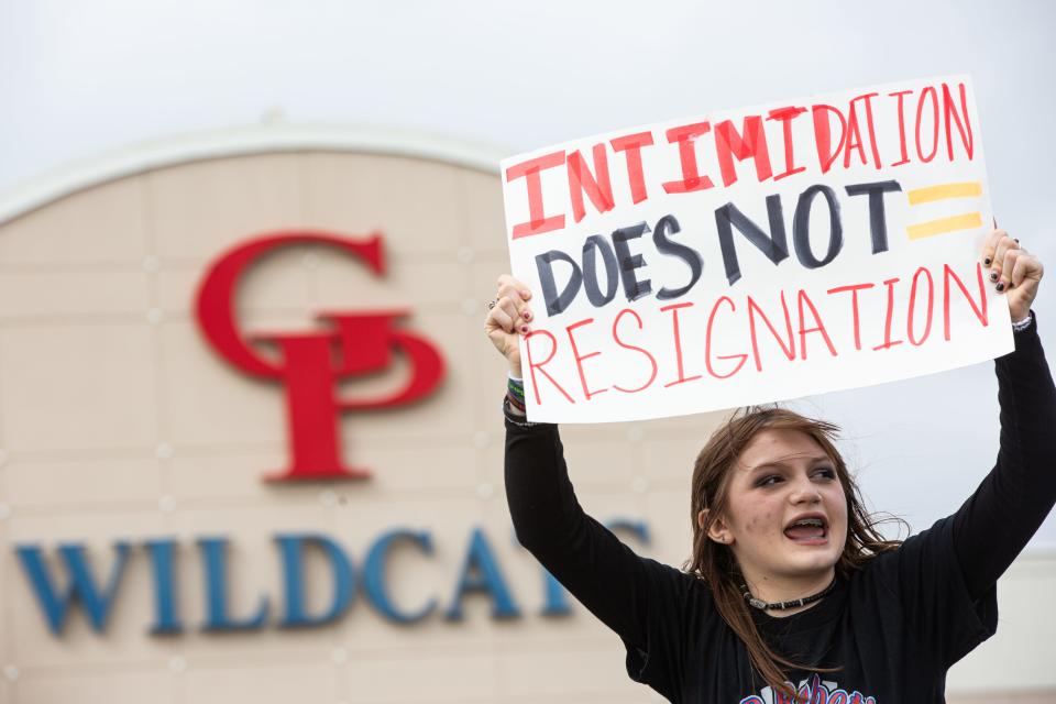 Gregory-Portland freshman Charlotte Harman holds a sign during a walkout on Wednesday, Feb. 21, 2024, in Portland, Texas. The walkout was to show support a STEM and robotics teacher who parted ways with the school after an incident.