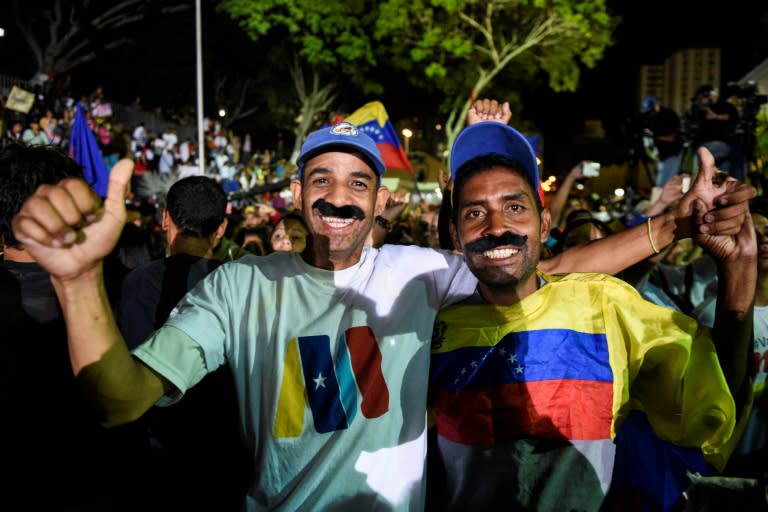 Supporters of the President Nicolas Maduro celebrate after the Venezuelan leader was officially declared the presidential election winner