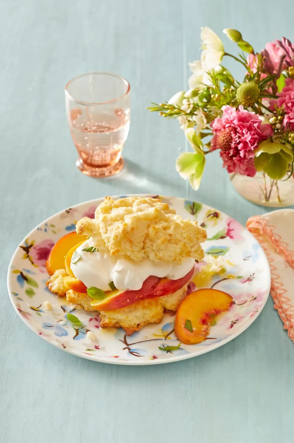 peaches and cream with basil on floral plate