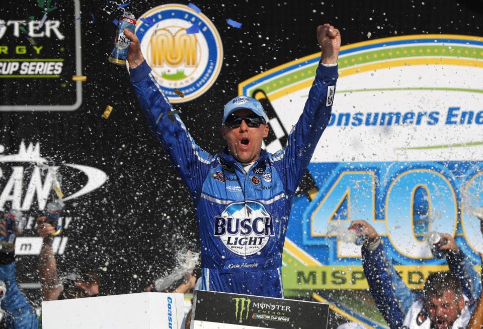 Kevin Harvick celebrates his victory after a NASCAR Cup Series auto race at Michigan International Speedway in Brooklyn, Mich., Sunday, Aug. 12, 2018. (AP Photo/Paul Sancya)