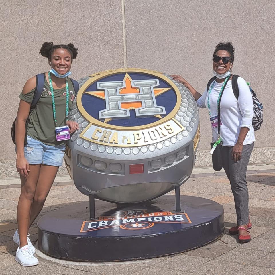 Zora Malone, left, and her mother Cheryl Anderson pose outside of Minute Maid Park in Houston prior to the Houston Astros and Atlanta Braves Game 1 matchup in the MLB World Series.