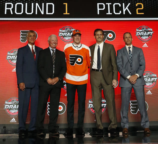 Nolan Patrick, center, wears a Philadelphia Flyers jersey after being selected by the team in the first round of the NHL hockey draft, Friday, June 23, 2017, in Chicago. (AP Photo/Nam Y. Huh)