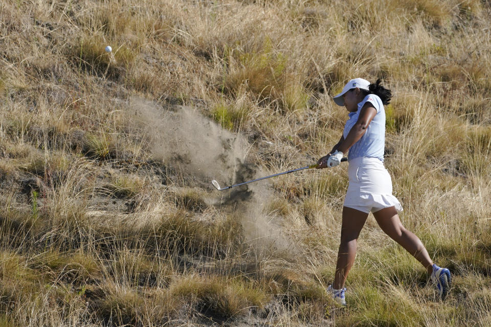 Monet Chun, of Canada, hits from the rough on the first hole, Sunday, Aug. 14, 2022, during the final round of the USGA Women's Amateur Golf Championship at Chambers Bay in University Place, Wash. (AP Photo/Ted S. Warren)