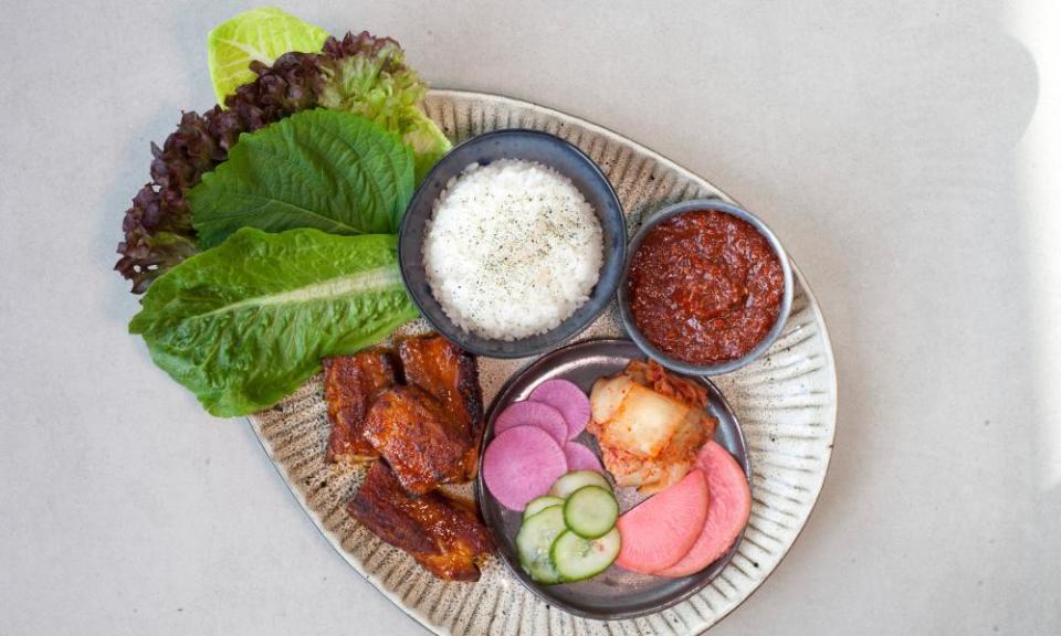 ‘The strident fermented chilli paste makes everything bounce and sing’: pork belly ssam.