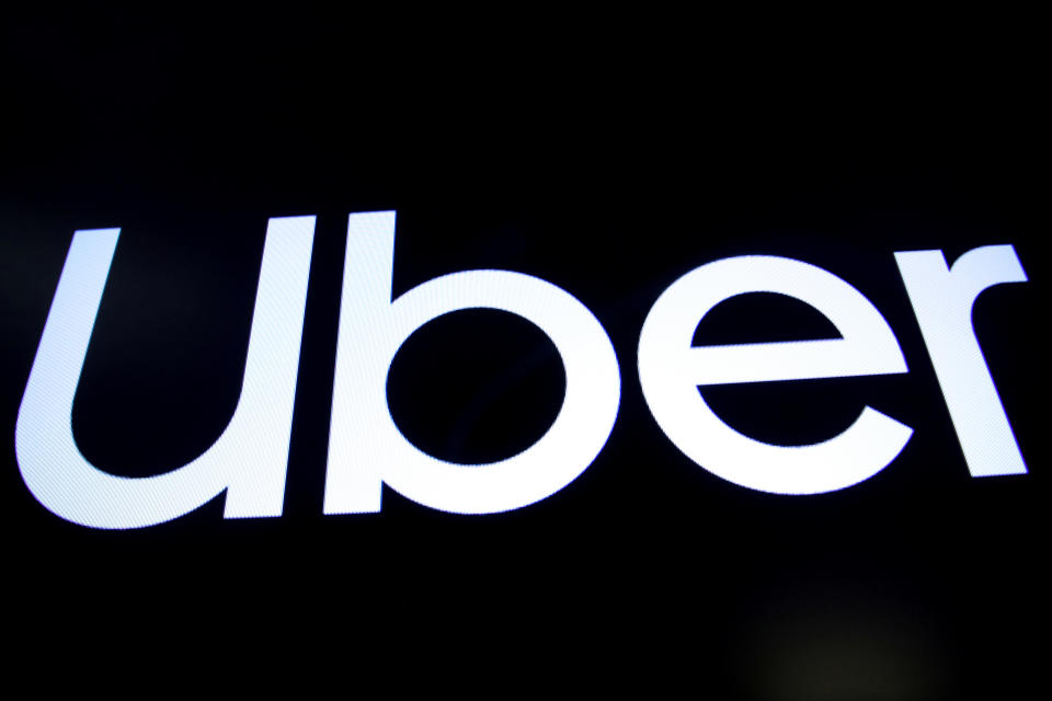 A screen displays the company logo for Uber Technologies Inc. on the day of it's IPO at the New York Stock Exchange (NYSE) in New York, U.S., May 10, 2019. REUTERS/Brendan McDermid