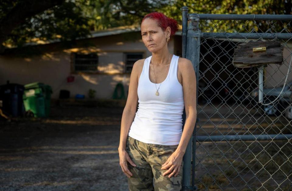 Luisa Yanes Perez, a recently arrived Cuban woman who came by boat 3 months ago, stands in front of the house she lives in with her husband and other recently arrived Cuban migrants. In late December, other members of her family attempted the same journey Luisa had made but they have not been heard from.