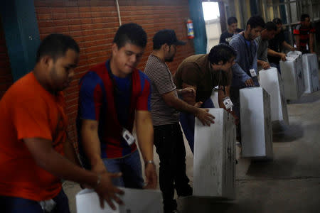 Soldiers move election materials for distribution at voting stations ahead of the November 26 presidential election in Tegucigalpa, Honduras, November 25, 2017. REUTERS/Edgard Garrido