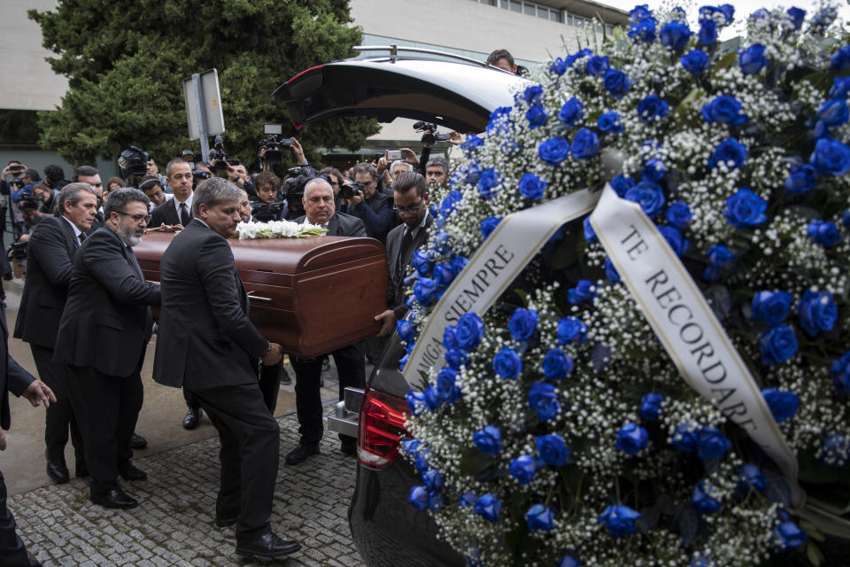 Montserrat Caballe's coffin is carried by burial services workers, during her funeral at the municipal mortuary in Barcelona, Spain, Monday, Oct. 8, 2018. Caballe, a Spanish opera singer renowned for her bel canto technique and her interpretations of the roles of Rossini, Bellini and Donizetti died on Saturday. She was 85. (AP Photo/Emilio Morenatti)