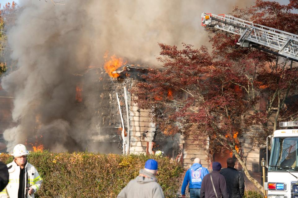 Firefighters from Wayne battle a fire that engulfed a home on Camillo Drive in Wayne, N.J. on Thursday Nov. 11, 2021. 