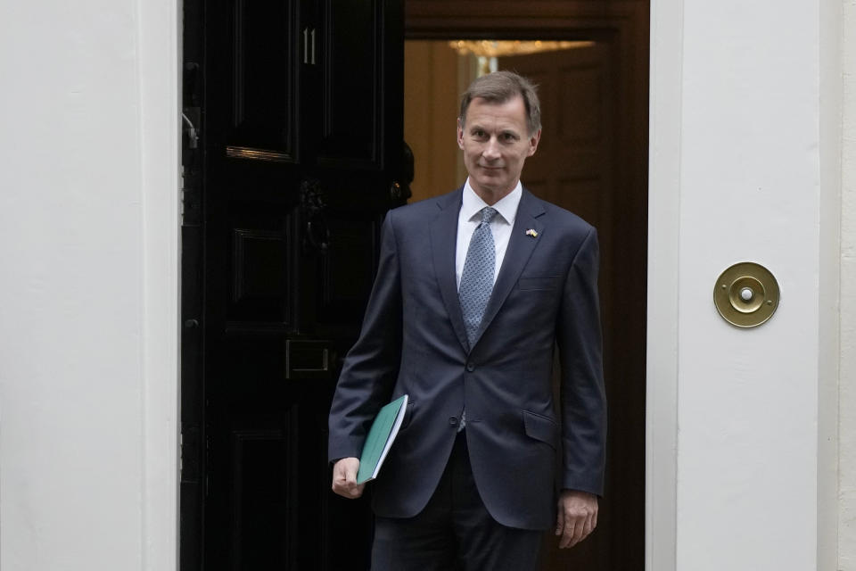 Britain's Chancellor Jeremy Hunt leaves 11 Downing Street to attend Parliament in London, Thursday, Nov. 17, 2022. Just three weeks after taking office, British Prime Minister Rishi Sunak faces the challenge of balancing the nation's budget while helping millions of people slammed by a cost-of-living crisis. Treasury chief Jeremy Hunt will deliver the government's plan for tackling a sputtering economy in a speech to the House of Commons on Thursday. (AP Photo/Alastair Grant)