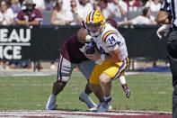 LSU quarterback Max Johnson (14) is sacked by Mississippi State defensive end Aaron Odom during the first half of an NCAA college football game, Saturday, Sept. 25, 2021, in Starkville, Miss. (AP Photo/Rogelio V. Solis)