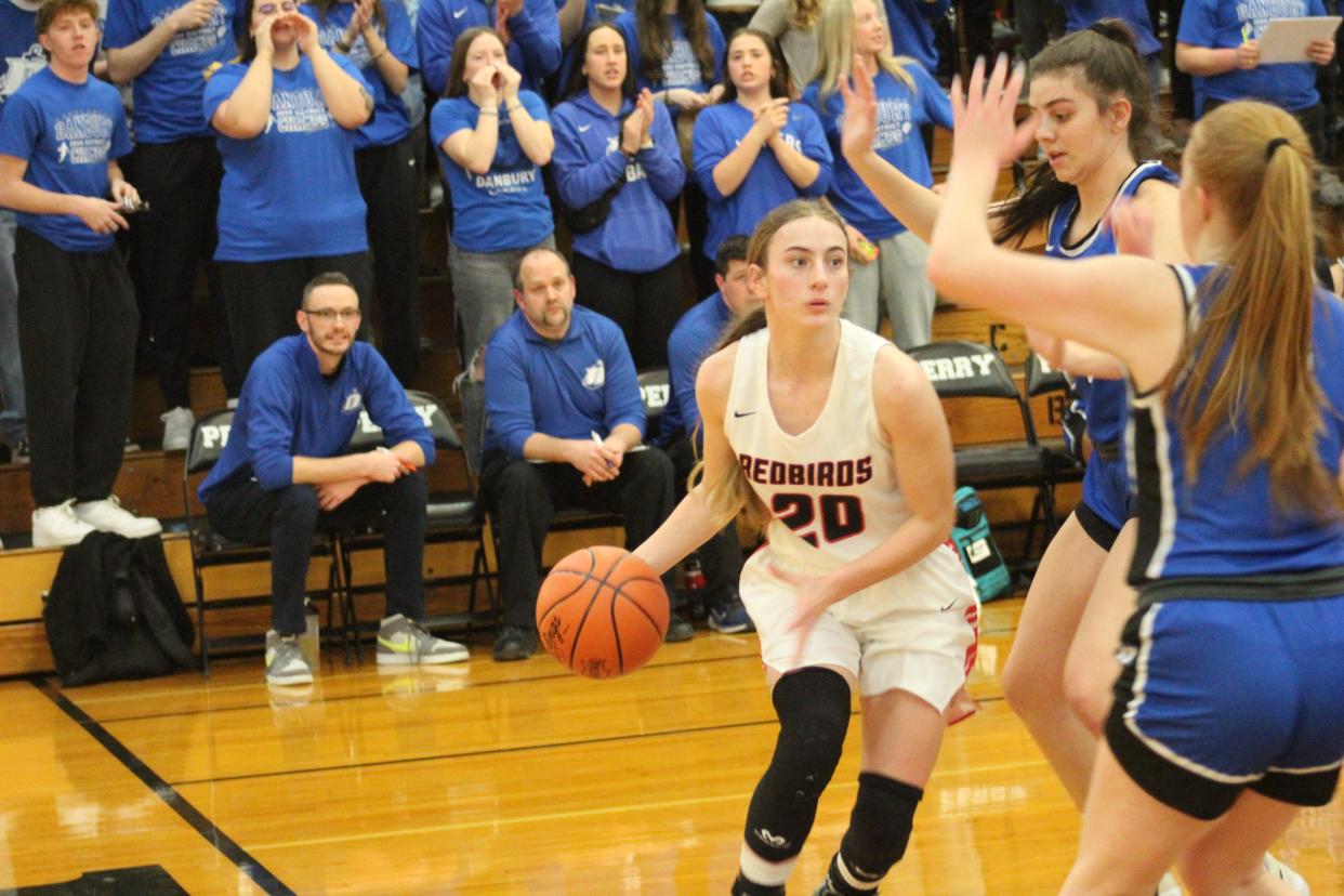 Loudonville's Sophia Spangler tries to maneuver around two Danbury defenders.