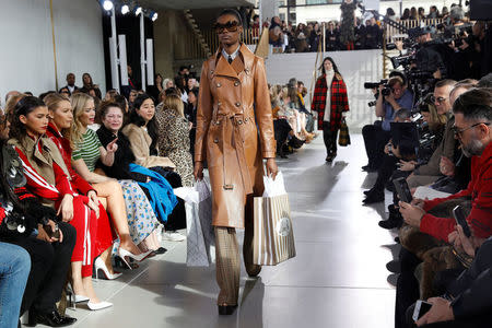 Models present creations from the Michael Kors 2018 fall collection during New York Fashion Week, in New York, U.S., February 14, 2018. REUTERS/Shannon Stapleton