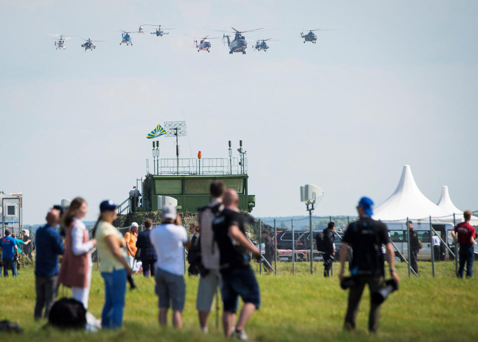 Visitors watch an exhibition flight