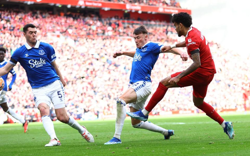 The ball strikes the arm of Everton's Michael Keane before Liverpool are awarded a penalty following a VAR review